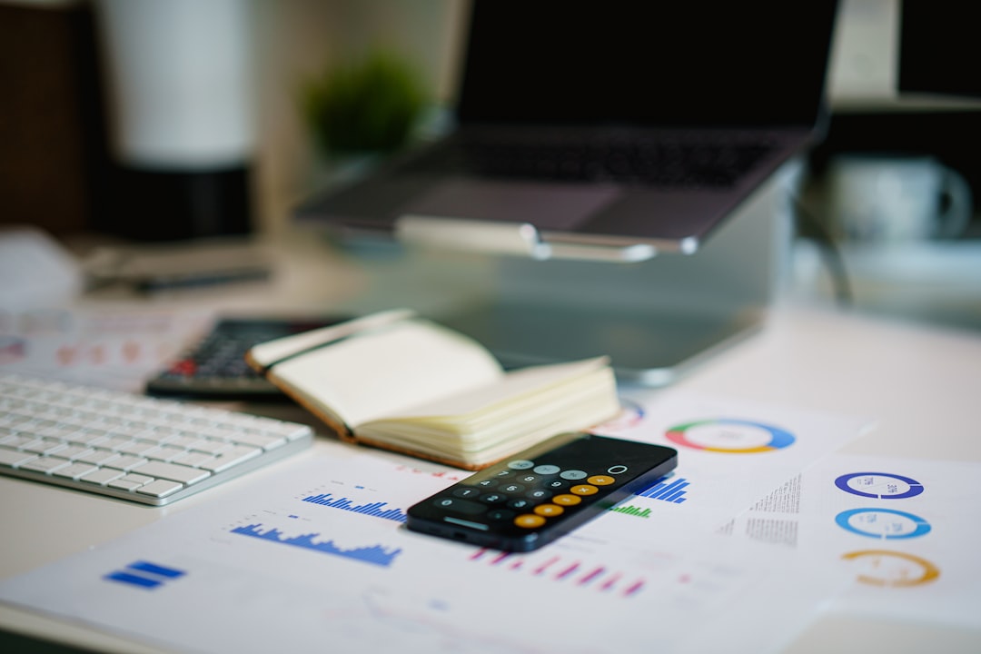 Small business financial planning with charts, calculator and laptop for financial formulas workbook